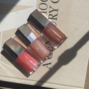 3 small .18 fl oz Fenty lipgloss. Cake Shake. Baby Bruit. Taffy Tease.